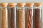 Assortment Of Spices In Glass Bottles Stock Photo