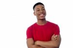 Young Man Posing With Folded Arms Stock Photo