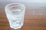 Glass Of Cold Water On Wooden Table Stock Photo