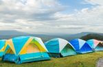 Group Of Tourist Tent On The Hills Stock Photo