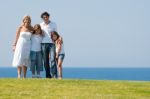 Happy family relaxing in garden Stock Photo