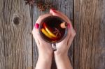 Mulled Wine And Spices On Weathered Wooden Table Stock Photo