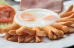 Breakfast With Sausage, Bacon, Fried Egg And Vegetable Stock Photo