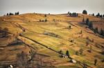 Sunny Spring Evening In Mountain Village. Fields And Hills Stock Photo