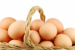 Close-up Of Eggs In A Wicker Basket On White Stock Photo