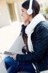 Beautiful Girl Listening To Music In City Stock Photo