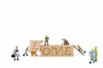 Miniature Worker Team Building Word Love On White Background Stock Photo