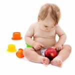 Cute Infant Boy With Apple Stock Photo