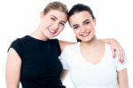 Two Teenage Friends Smiling In Front Of Camera Stock Photo