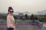 Asian Tourist Toothy Smiling Face Happiness Emotion In Chua Bai Dinh Temple One Of Most Popular  Traveling Destination Of Vietnam Stock Photo