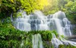 Fresh Green Plant And Rock In Middle Mun Dang Waterfall Rain Sea Stock Photo