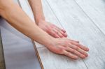 Handyman Laying Down Laminate Flooring Boards Stock Photo