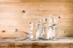 Assorted Glass Bottles On A White Washed Wooden Table. Clear Gla Stock Photo