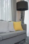 Yellow And Grey Pillows On Modern Sofa Stock Photo