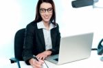 Businesswoman Writing An Important Document Stock Photo