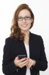 Cute Smiling Business Female Holding A Cell Phone Stock Photo