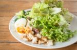 Homemade Salad Serving On Wooden Background Stock Photo