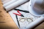 Construction Concept Image Helmet Rolled Blueprints On Wooden Bo Stock Photo