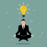 Businessman Thinking During Meditation Stock Photo