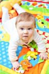 Infant Boy On Playmat Stock Photo