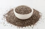 Chia Seeds In White Bowl On White Stock Photo