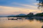 Traditional Thai Long Tail Boats At Sunset In Phuket Stock Photo