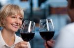 Couple Toasting In A Restaurant Stock Photo