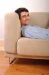 Man Relaxing On The Couch Stock Photo