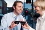 Happy Couple Toasting Wine At A Restaurant Stock Photo