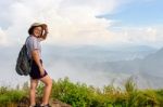 Tourist Teen Girl Poses On Mountain Stock Photo