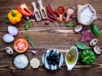 The Ingredients For Homemade Pizza On Shabby Wooden Background Stock Photo