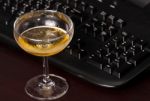 Wine Glass And Black Keyboard Stock Photo