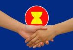 Asean Economic Community In Businessman Handshake Stock Photo