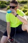 Handsome Young Man Drinking After Running Stock Photo