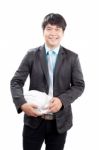 Young Asian Engineering Man Standing And Holding Safety Helmet I Stock Photo