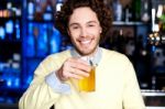 Young Guy Having Chilled Beer At Bar Stock Photo