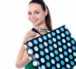 Smiling Lady Holding Shopping Bag Stock Photo