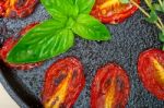 Baked Cherry Tomatoes With Basil Anf Thyme Stock Photo