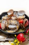 Fresh Clams On An Iron Skillet Stock Photo