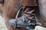 Cowboy Boot With Spur And Horse Stock Photo