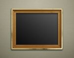 Empty Golden Vintage Frame On Wallpaper Background Stock Photo