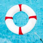 Life Ring At The Swimming Pool. Life Ring On Water. Life Ring On Stock Photo