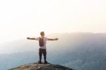 Young Man  Asia Tourist  At Mountain Is Watching Over The Misty Stock Photo