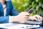 Handsome Businessman Wearing Suit And Using Modern Laptop Outdoo Stock Photo