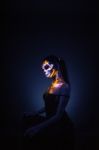 Girl's Face Painted Uv Skull Stock Photo