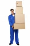 Young Man Holding Cardboard Box Stock Photo