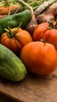 Several Vegetables On Wooden Chopping Board And Table Stock Photo