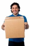 Man Carrying Cardboard Box Stock Photo