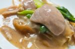 Rad Na, Famous Thai Chinese Style Wide Rice Noodle Dish With Tasty Tender Pork With Thick Gravy Sauce. Close Up Stock Photo