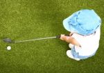 Small Child Playing Golf Stock Photo